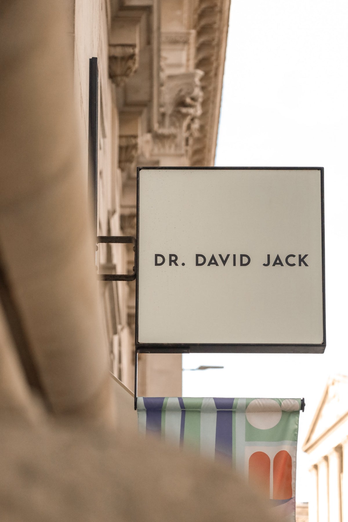 Dr David Jack clinic sign on a London street