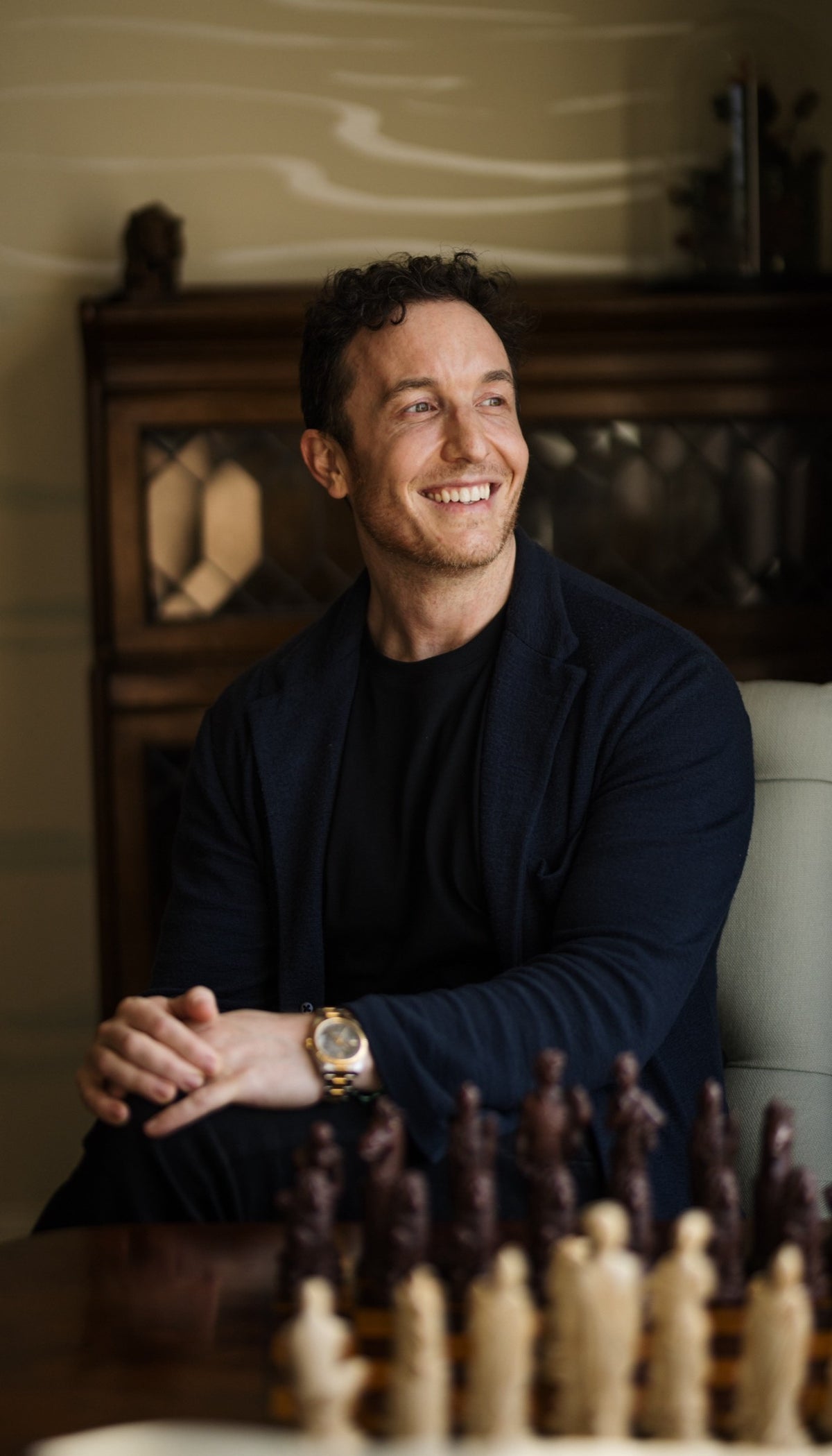 Dr David Jack, founder, seated and smiling