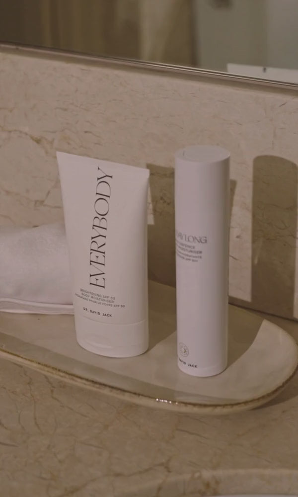 Dr David Jack skincare bottles on a bathroom shelf